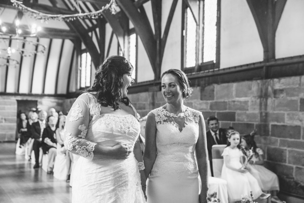 Two brides in wedding ceremony, Lord Leycester Hospital
