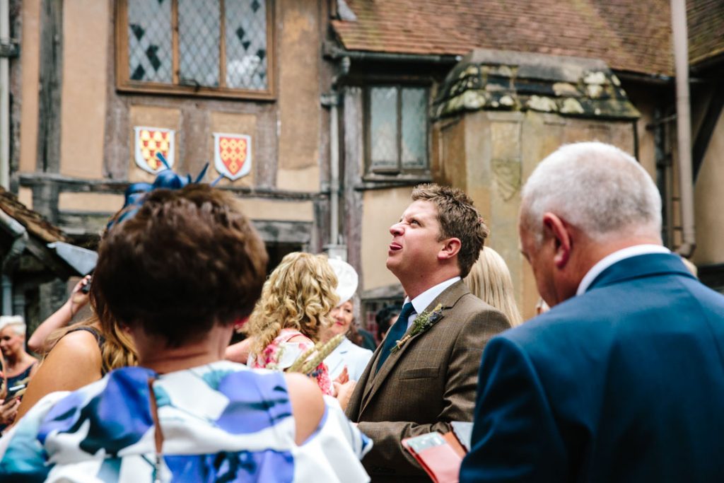 Man pulling tongue out at children, Lord Leycester hospital