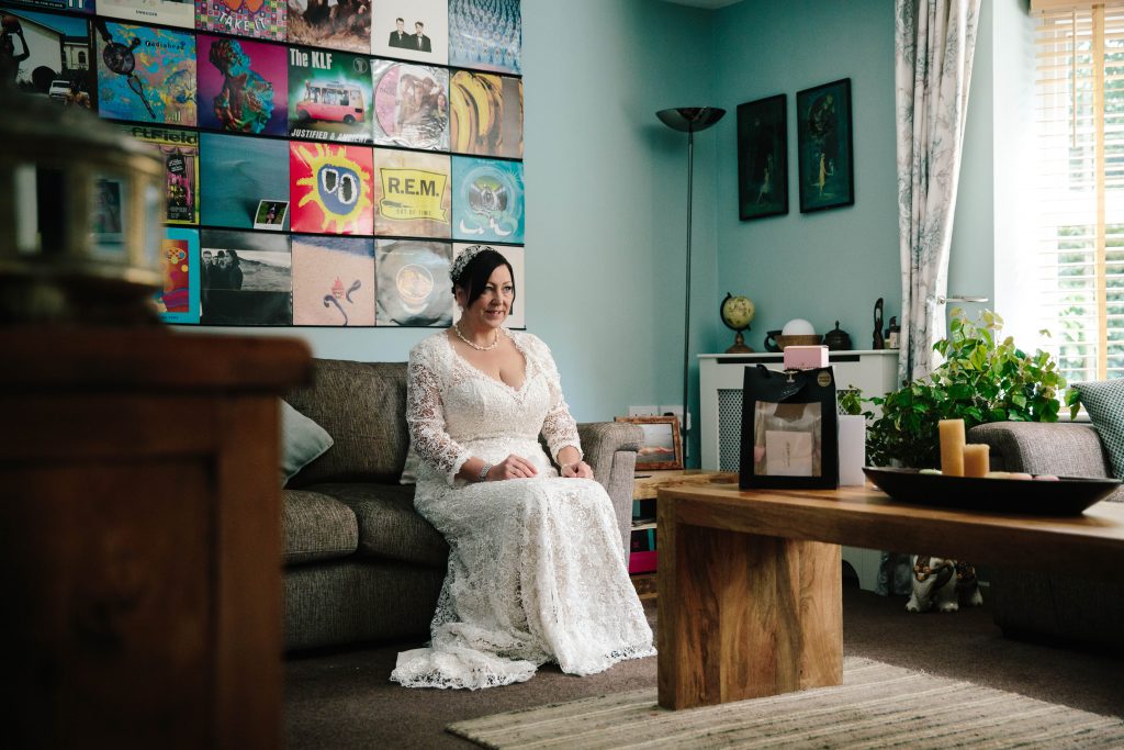bride sitting in lounge, waiting to go to her wedding