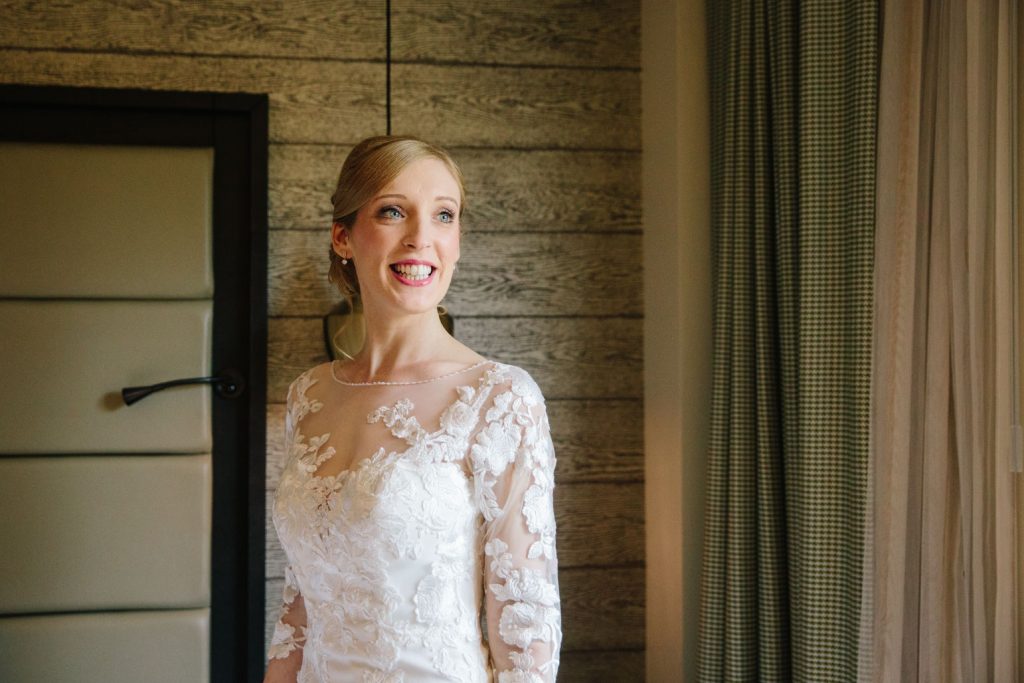 Bride smiling looking radiant in her wedding dress