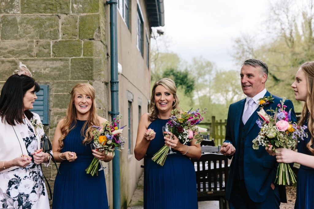 Bridesmaids and Father of bride ready to throw confetti, Saxon Mill wedding