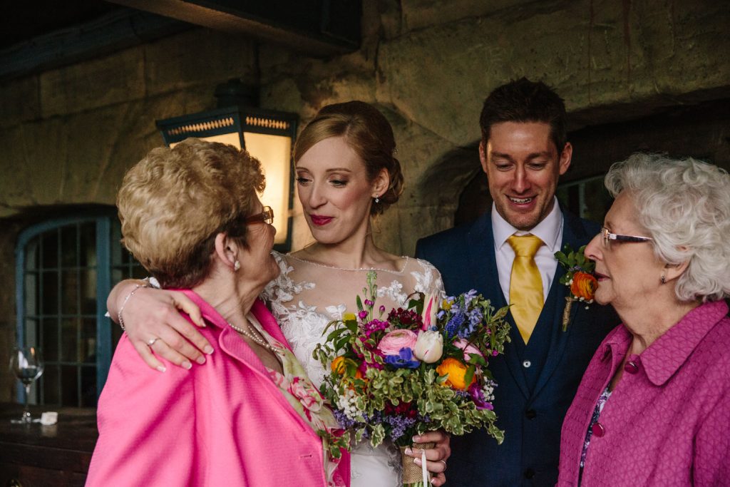 Bride and groom with Nan's at their wedding at the Saxon Mill