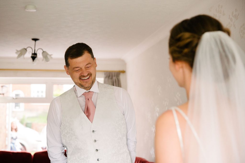 Father seeing bride in her dress for the first time