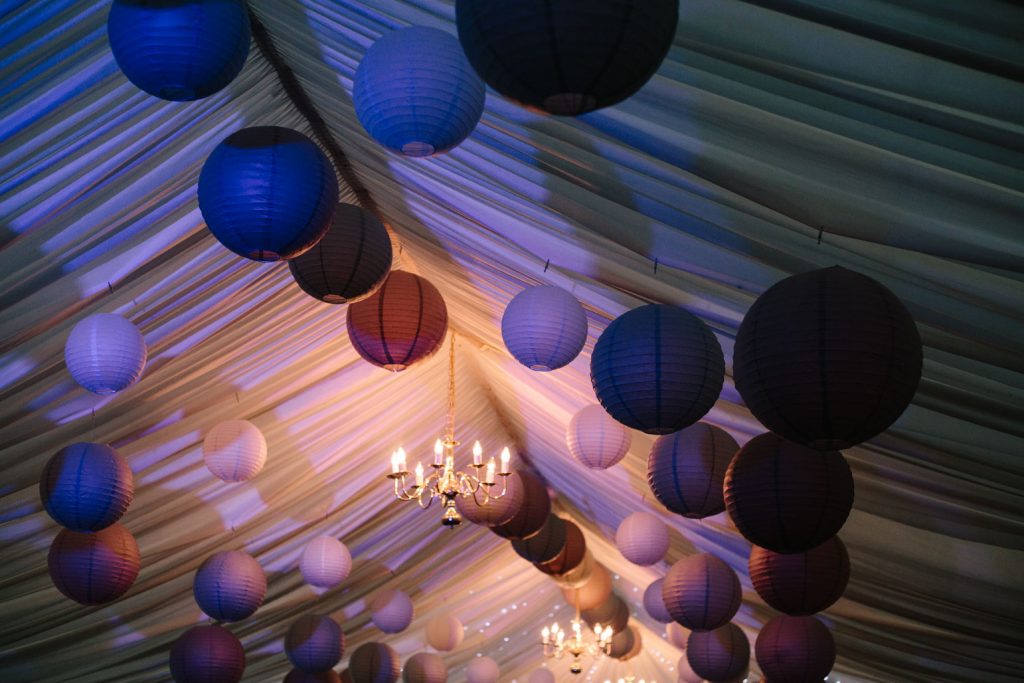 paper lanterns hanging in a marquee wedding