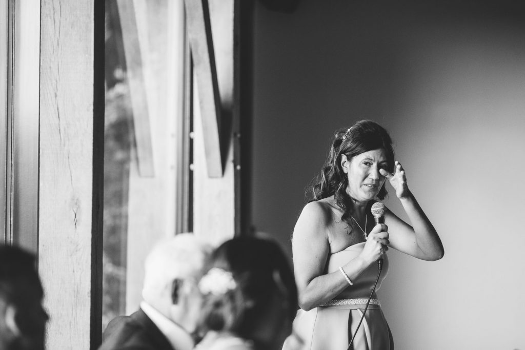 Bridesmaid crying, giving a speech at wedding breakfast