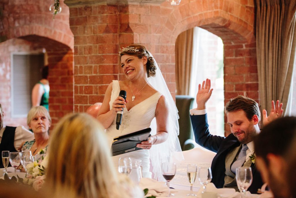 Bride giving a speech at her wedding at The Welcome, stratford in Arden 
