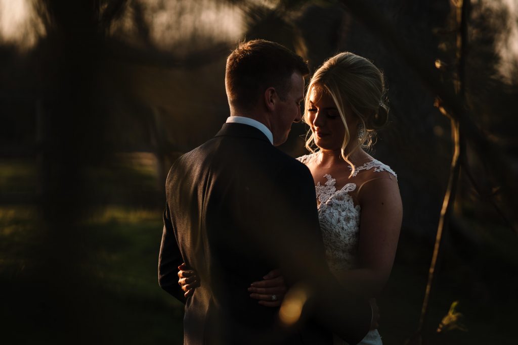 sunset shot of bride and groom