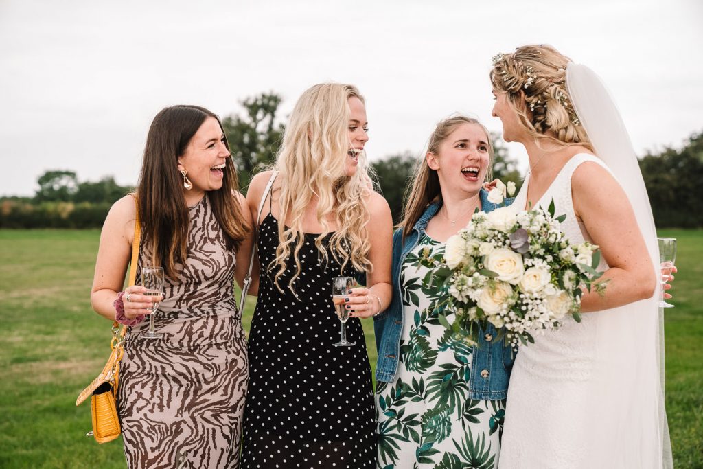 guests laughing with bride
