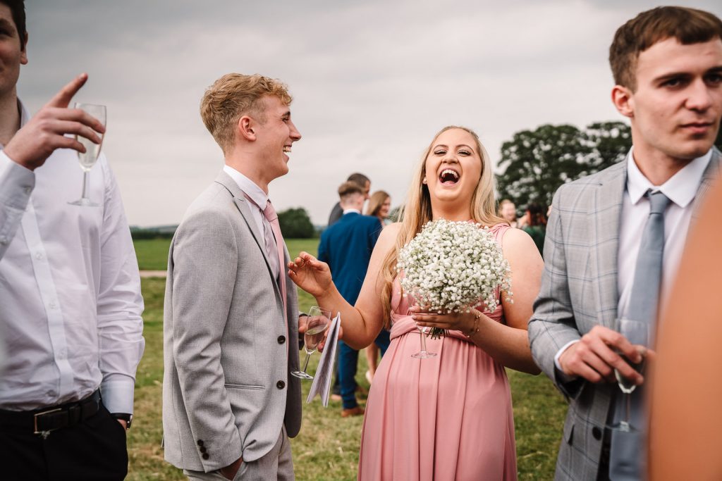 Guests laughing at wedding