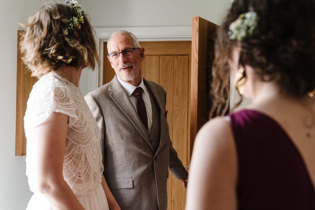 dad seeing daughter in her wedding dress