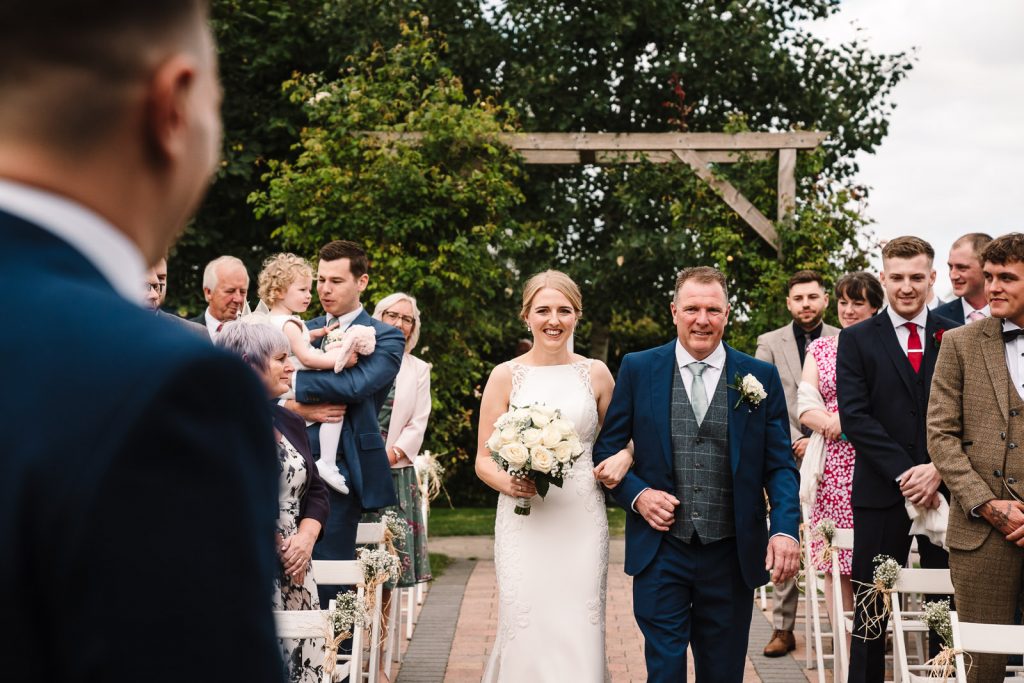 bride and her dad walking down the aisle at wootton park wedding