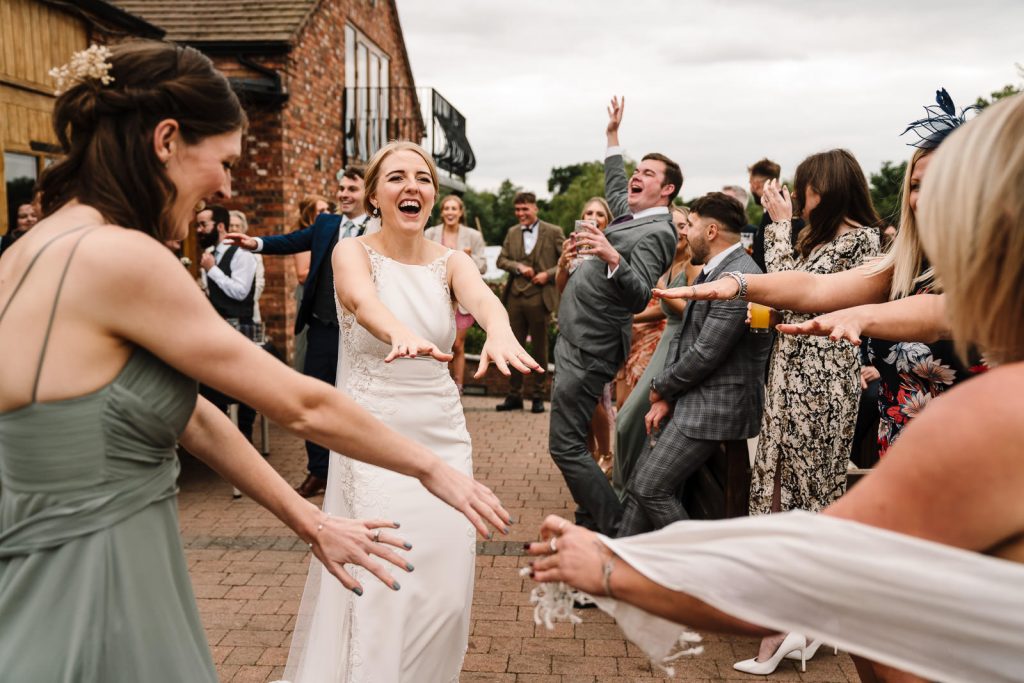 bride dancing with guests during drinks reception at wootton park wedding 
