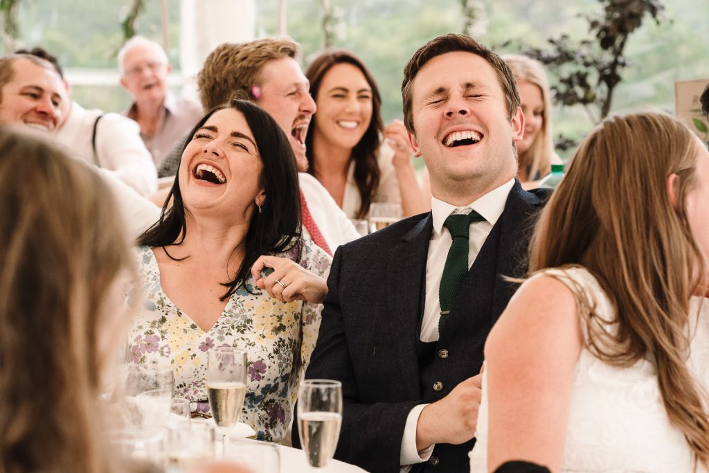 guests laughing at wedding speeches at Warwickshire wedding