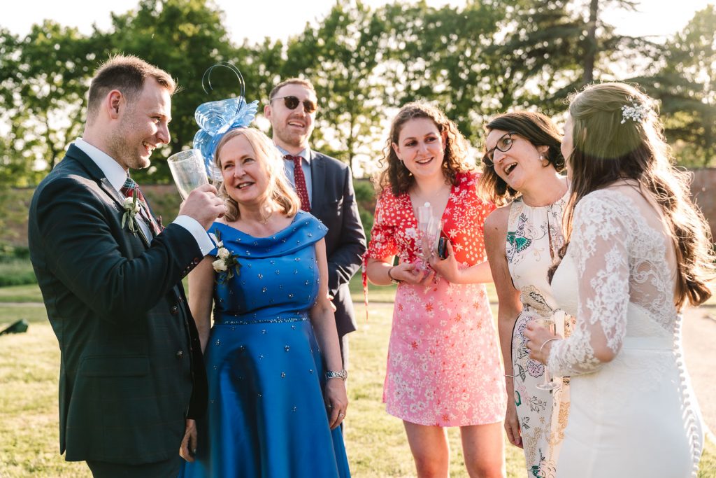 guest laughing and chatting at wedding, thorpe garden, staffordshire