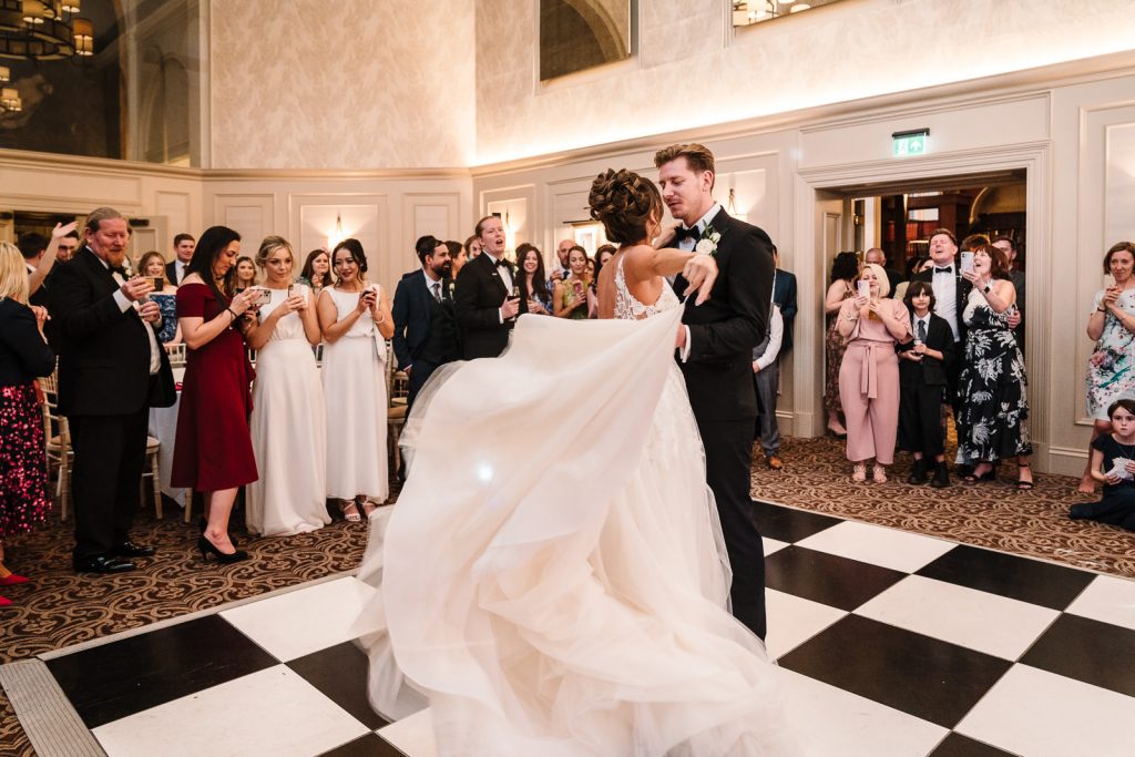 bride and groom dancing their first dance in st annes hall, stanbrook abbey